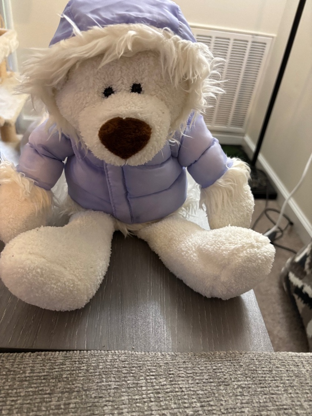 White bear and purple Parker stuffed animal